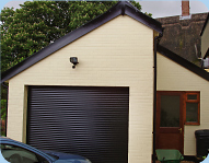 Garage with automated door by Buff Construction